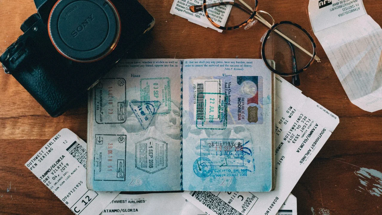 A blue and white identity card resting on a dark surface